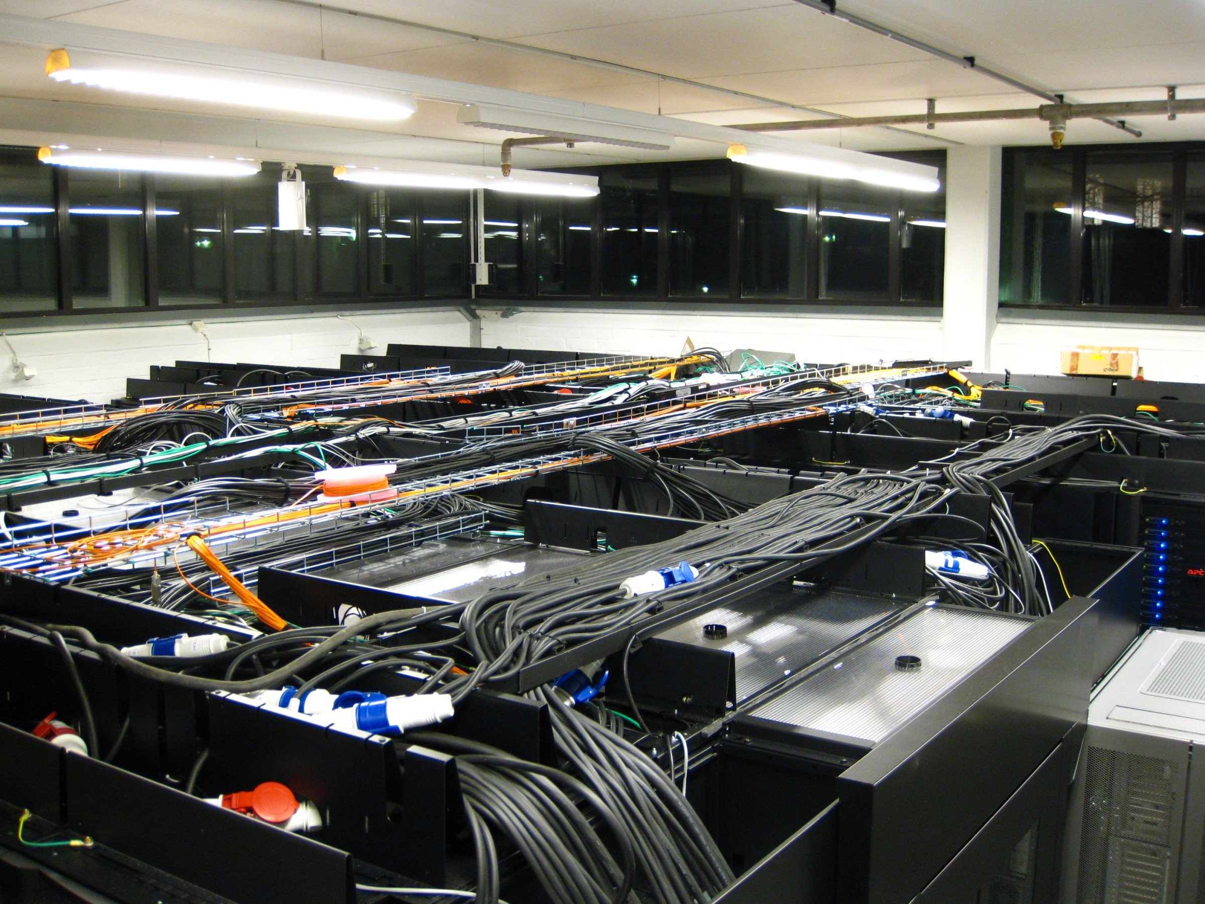 A server room with thick black power cables