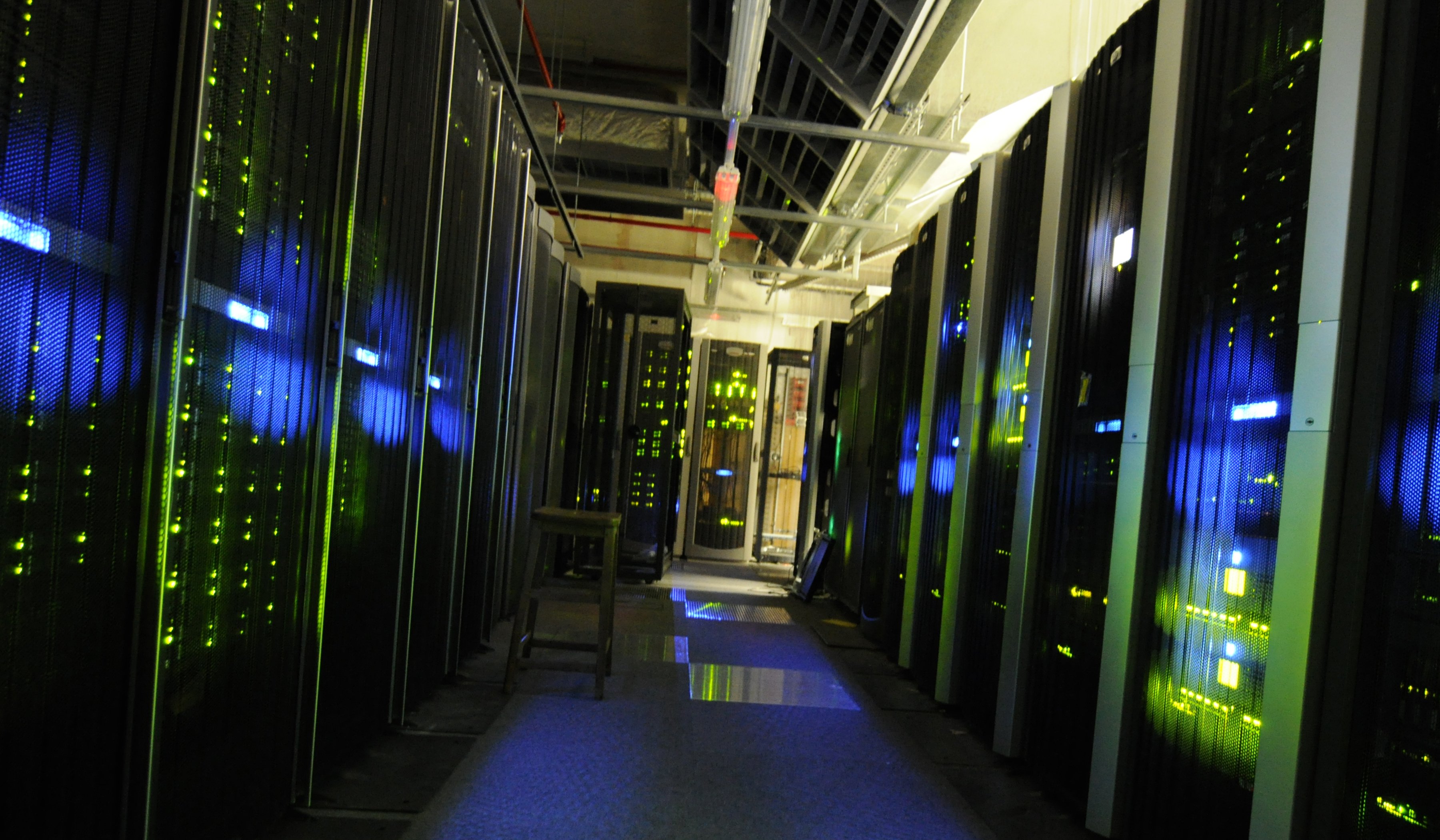 A server room with thick black power and network cables