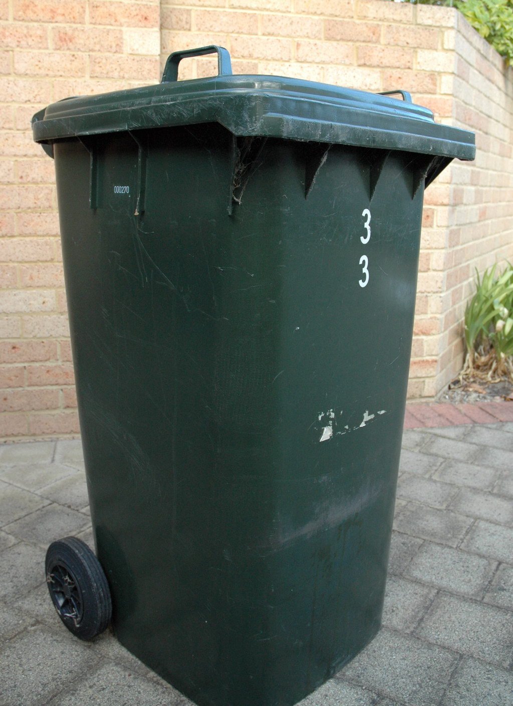 A single wheelie-style household rubbish bin