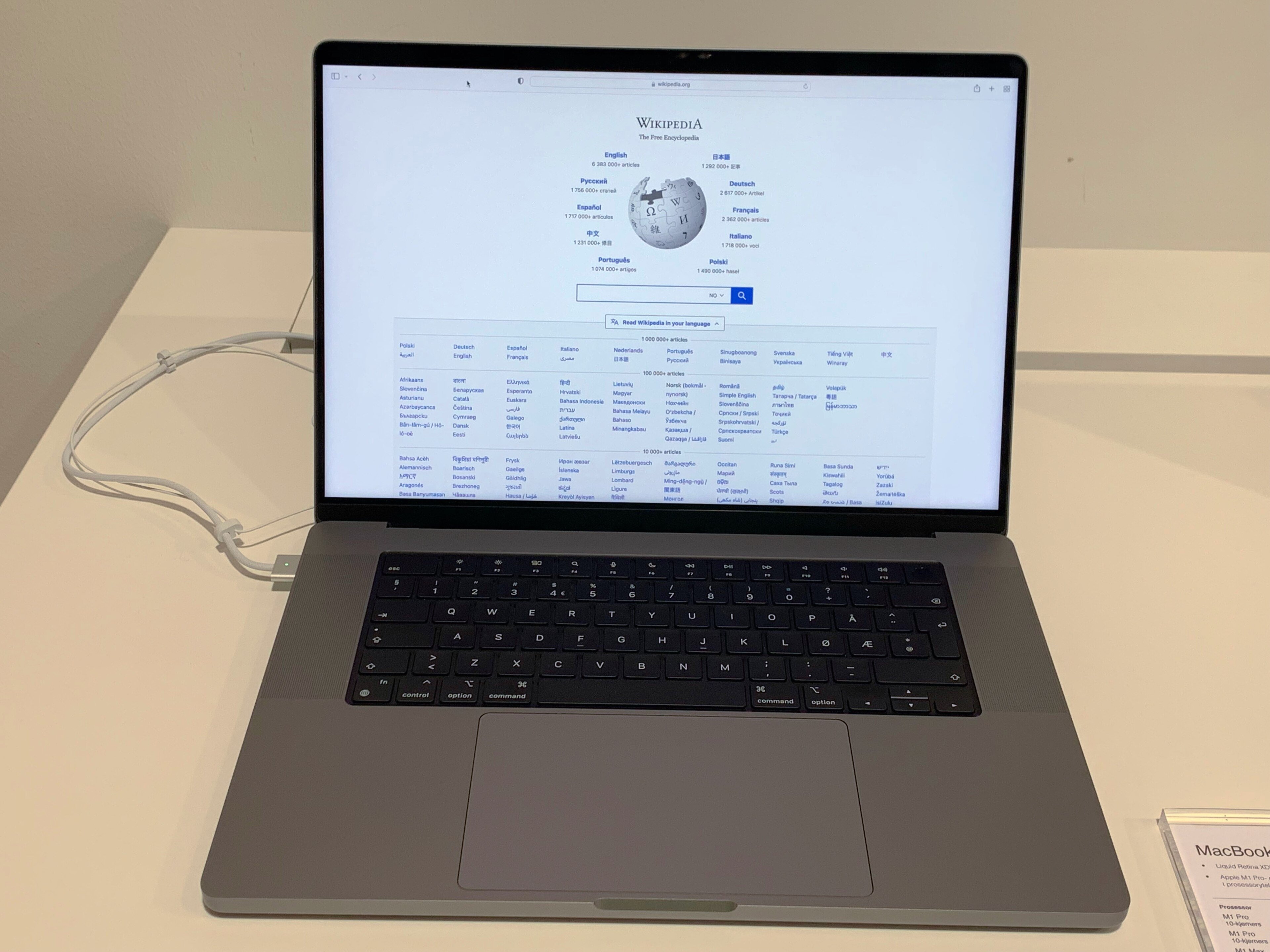 A 16-inch MacBook Pro laptop open on a desk