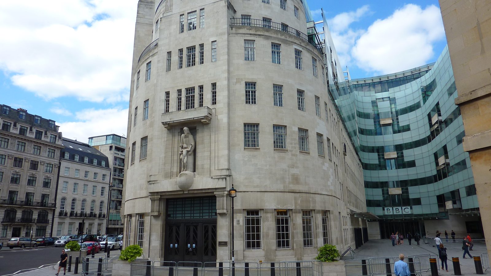 BBC Broadcasting House on Portland Place in London, the old stone building beside the curved glass extension