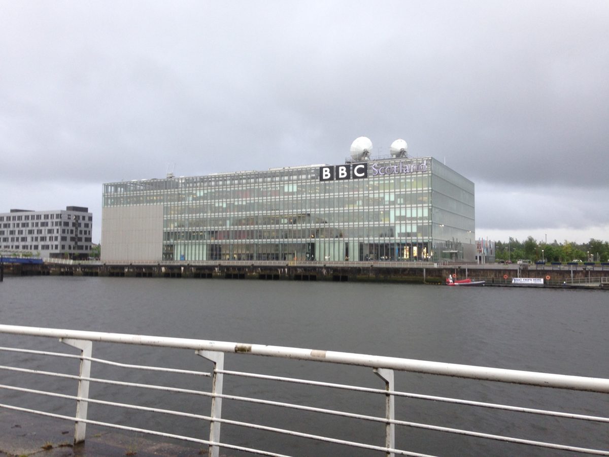 The glass BBC Scotland building at Pacific Quay in Glasgow, seen across the River Clyde