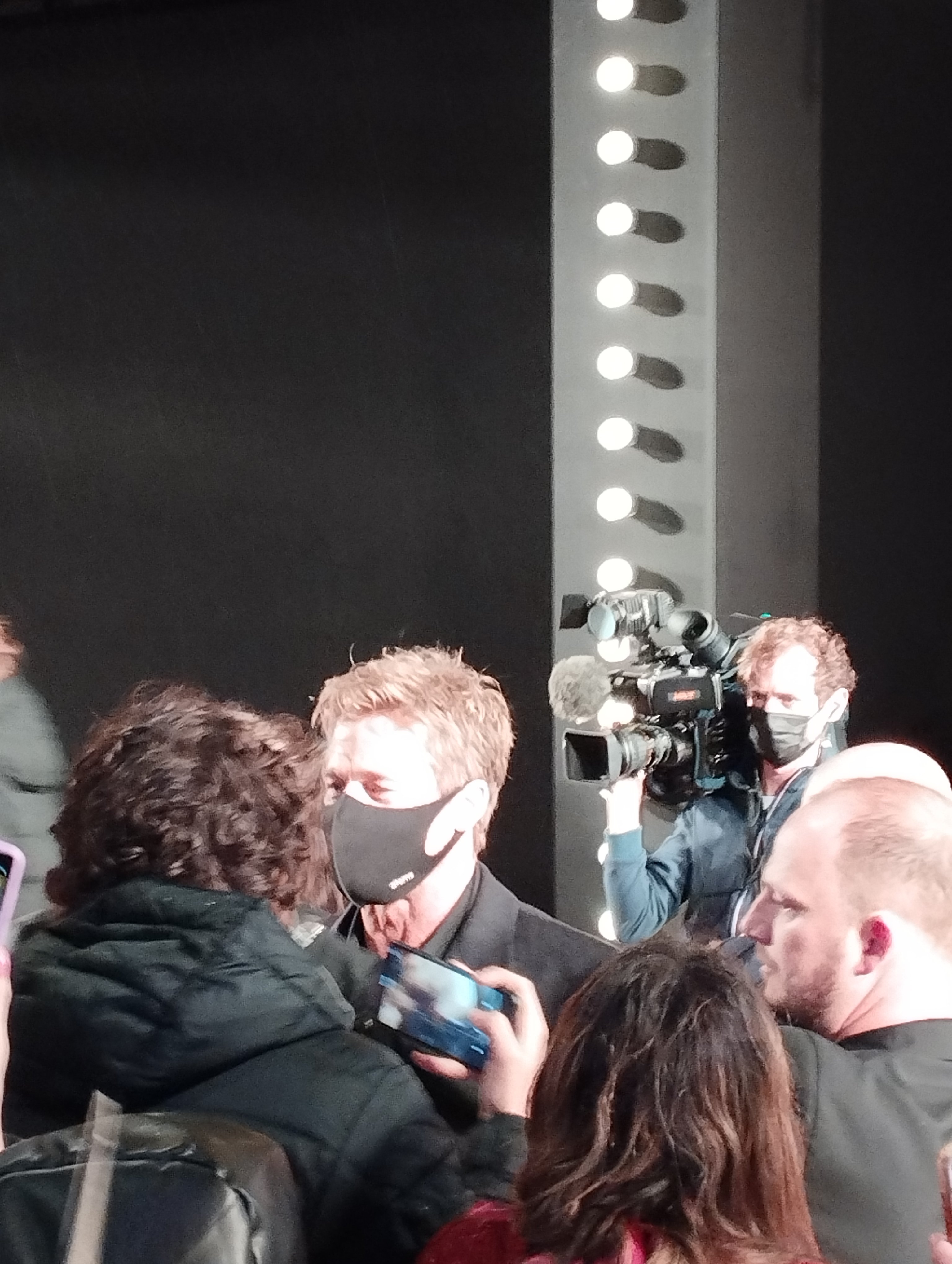 Brad Pitt signing autographs for fans outside the Grand Rex cinema in Paris