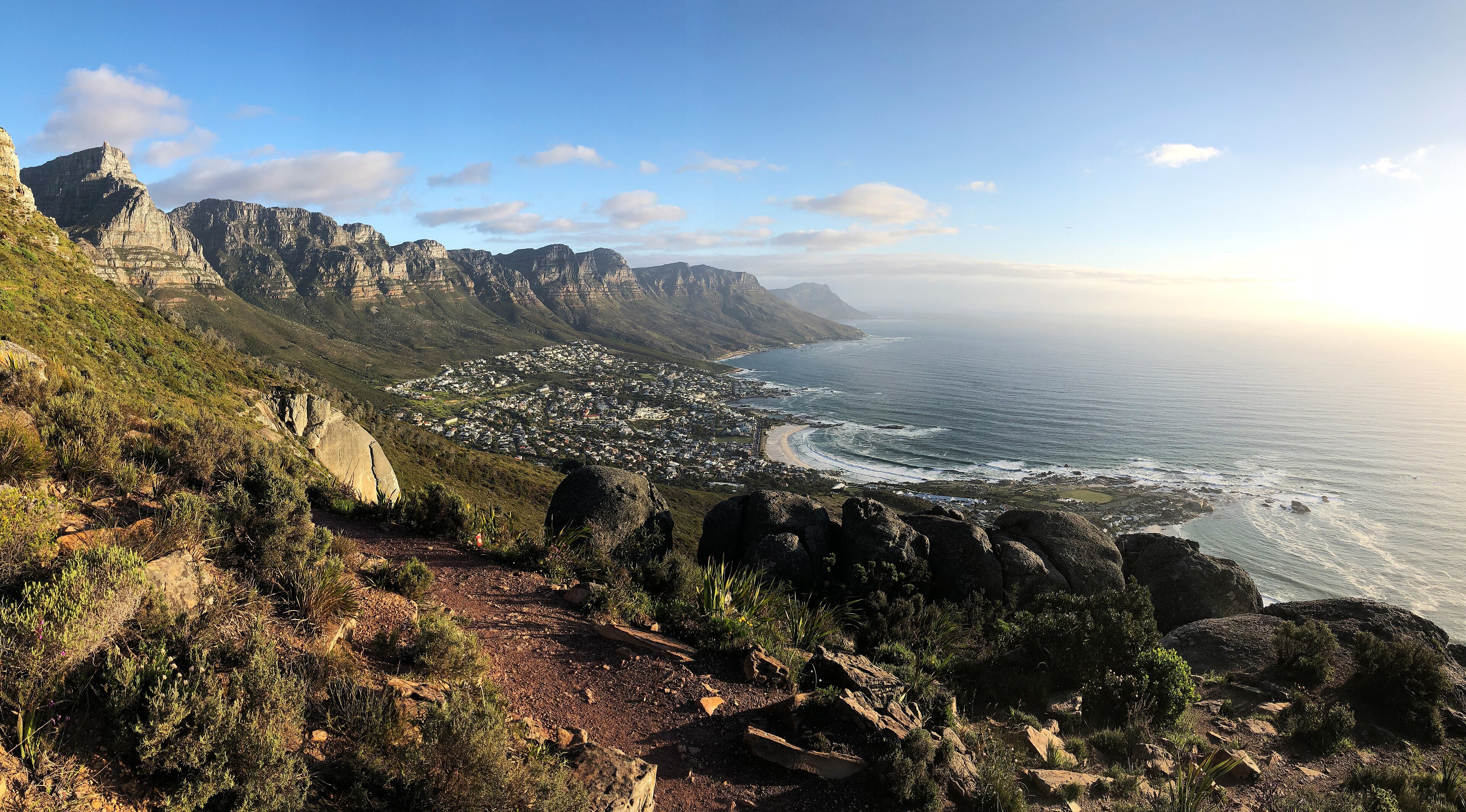 Camps Bay beach and the Twelve Apostles mountains seen from the path up Lion's Head in Cape Town