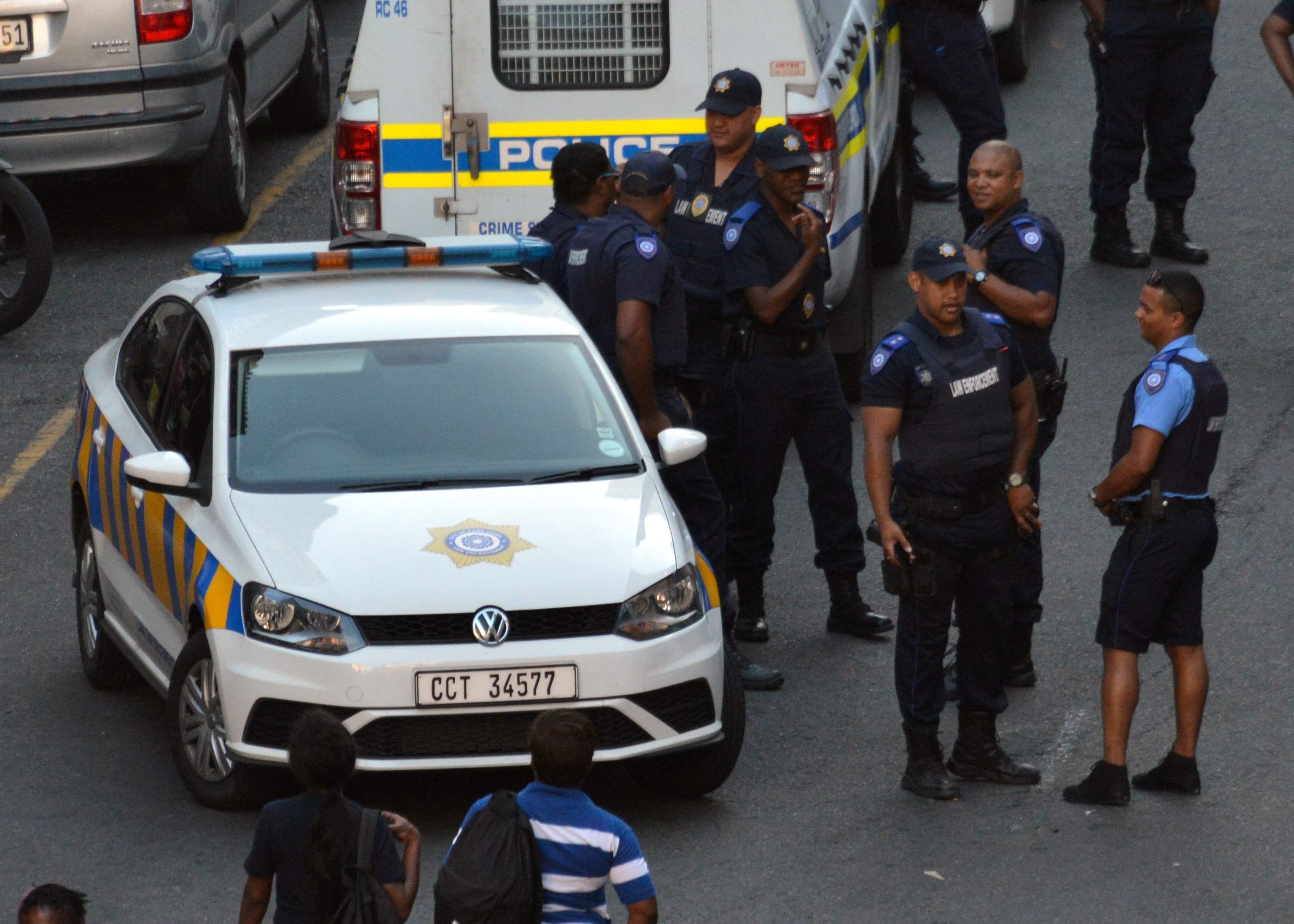 Cape Town Metro Police officers with a patrol vehicle, part of the force the City and province fund themselves