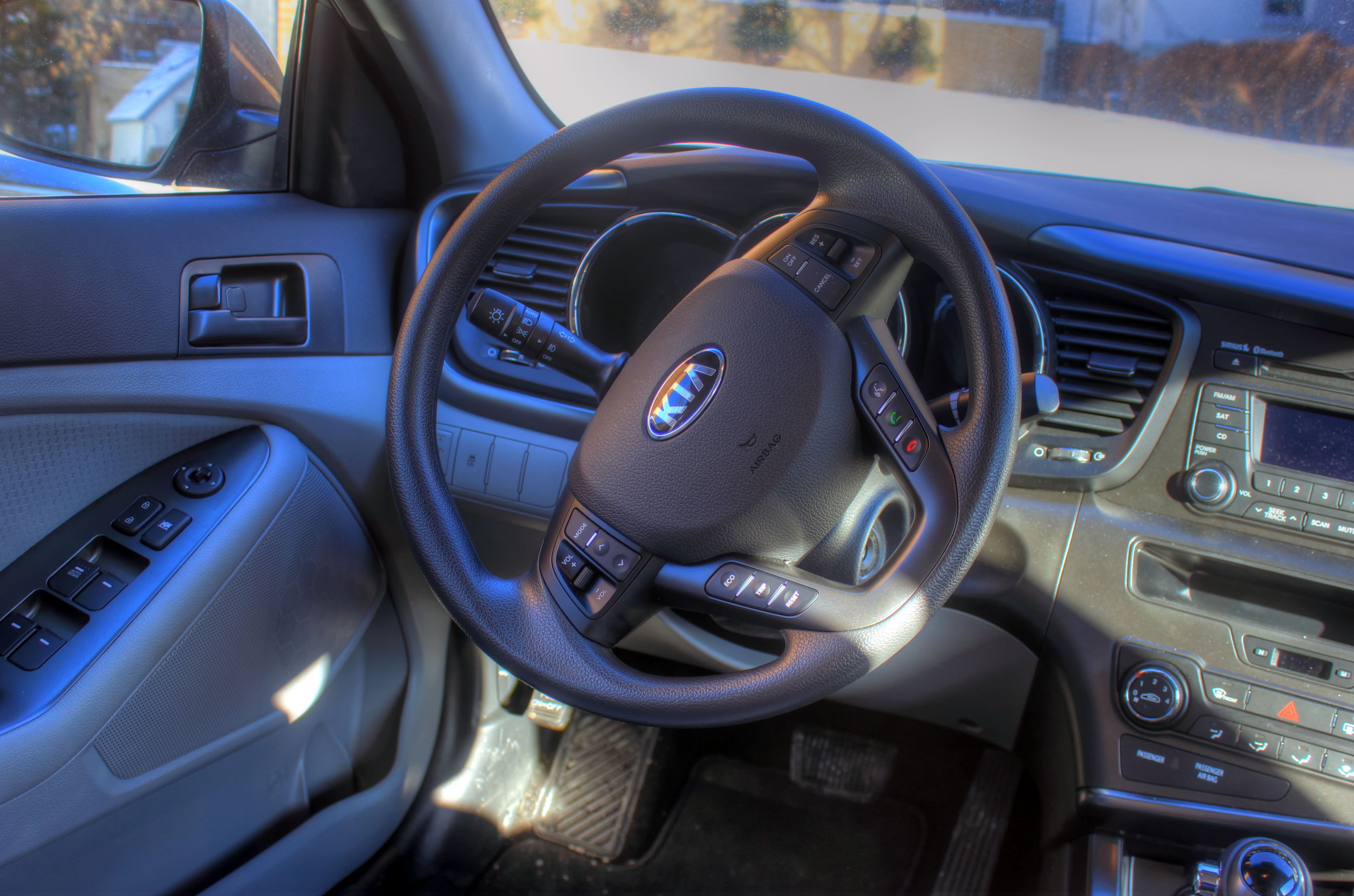 A car steering wheel and dashboard