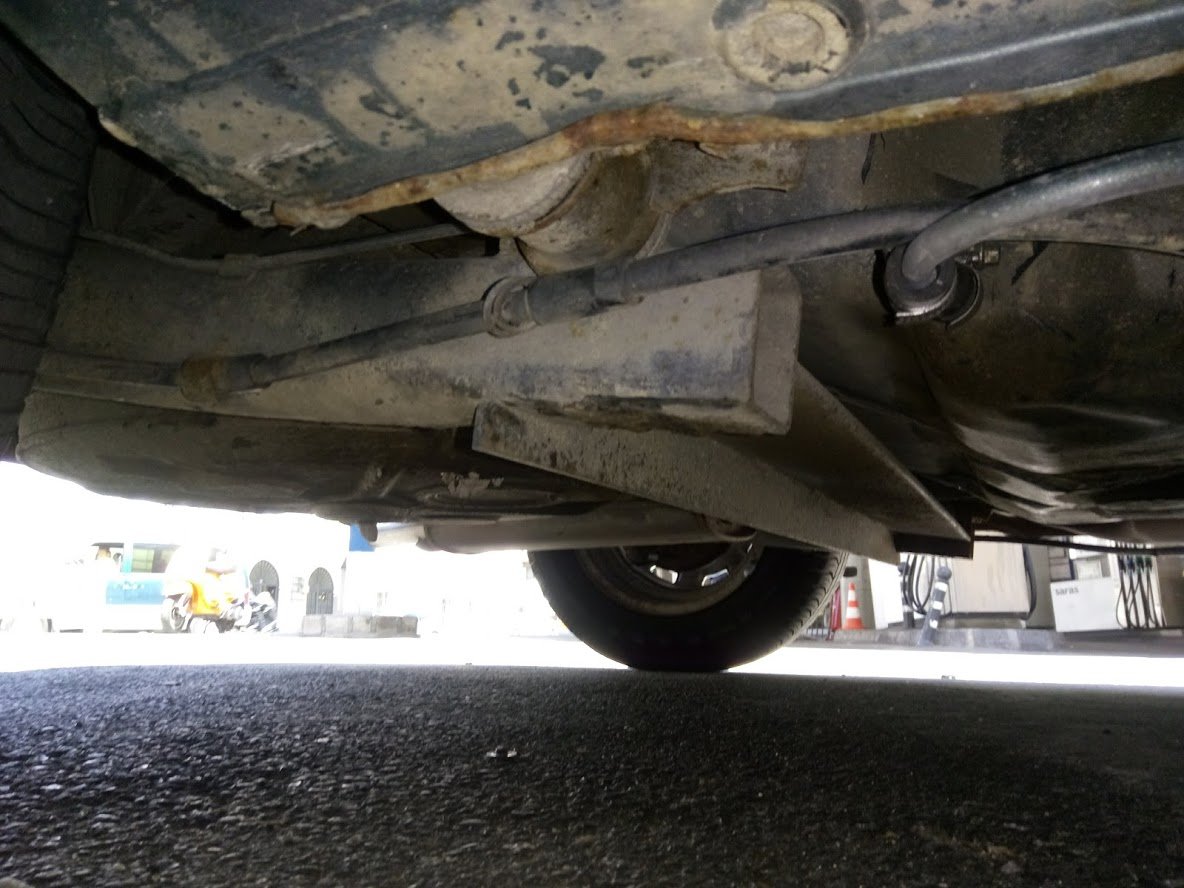 A bare twist beam rear axle with its springs and mounts