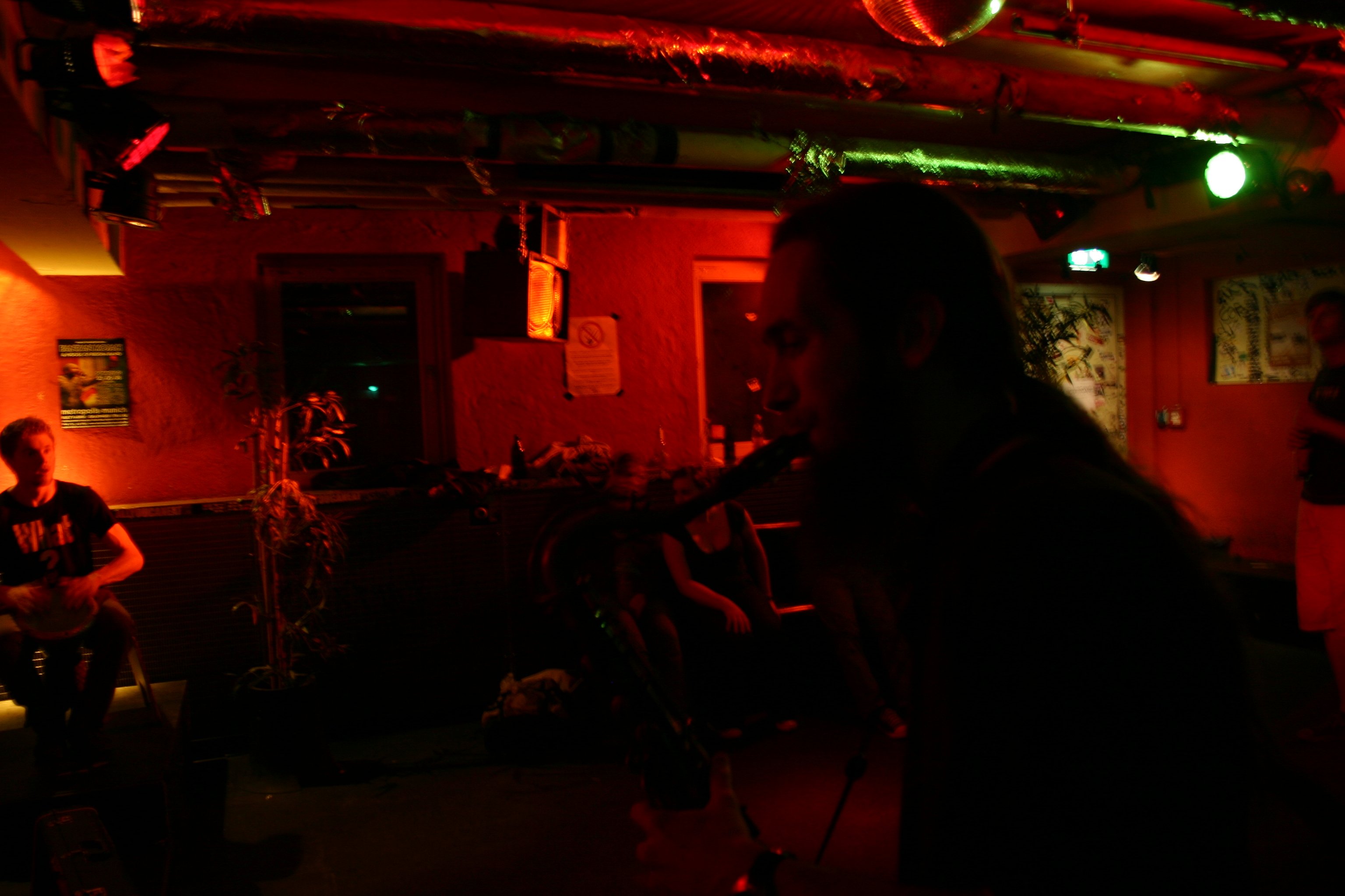 A crowded club night with people dancing under bright lights