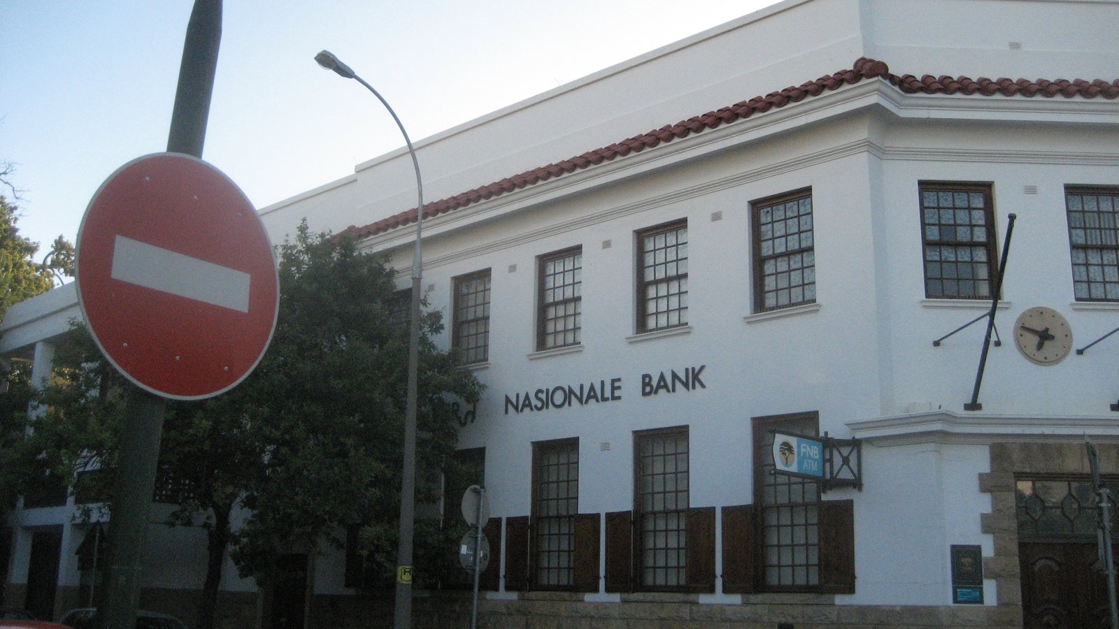 A white First National Bank building in Stellenbosch with Nasionale Bank lettering