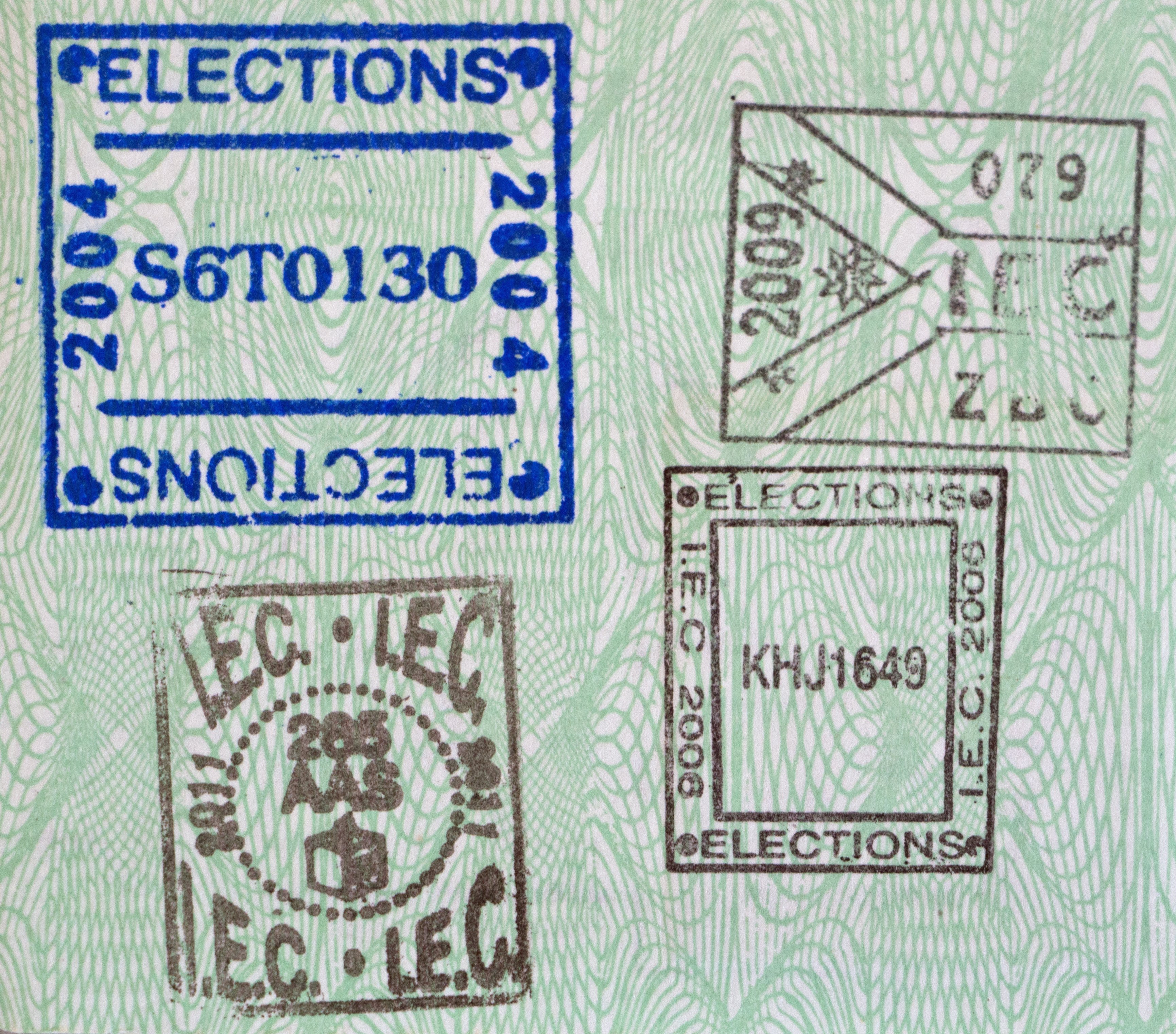 A voting record stamped inside a green South African ID book