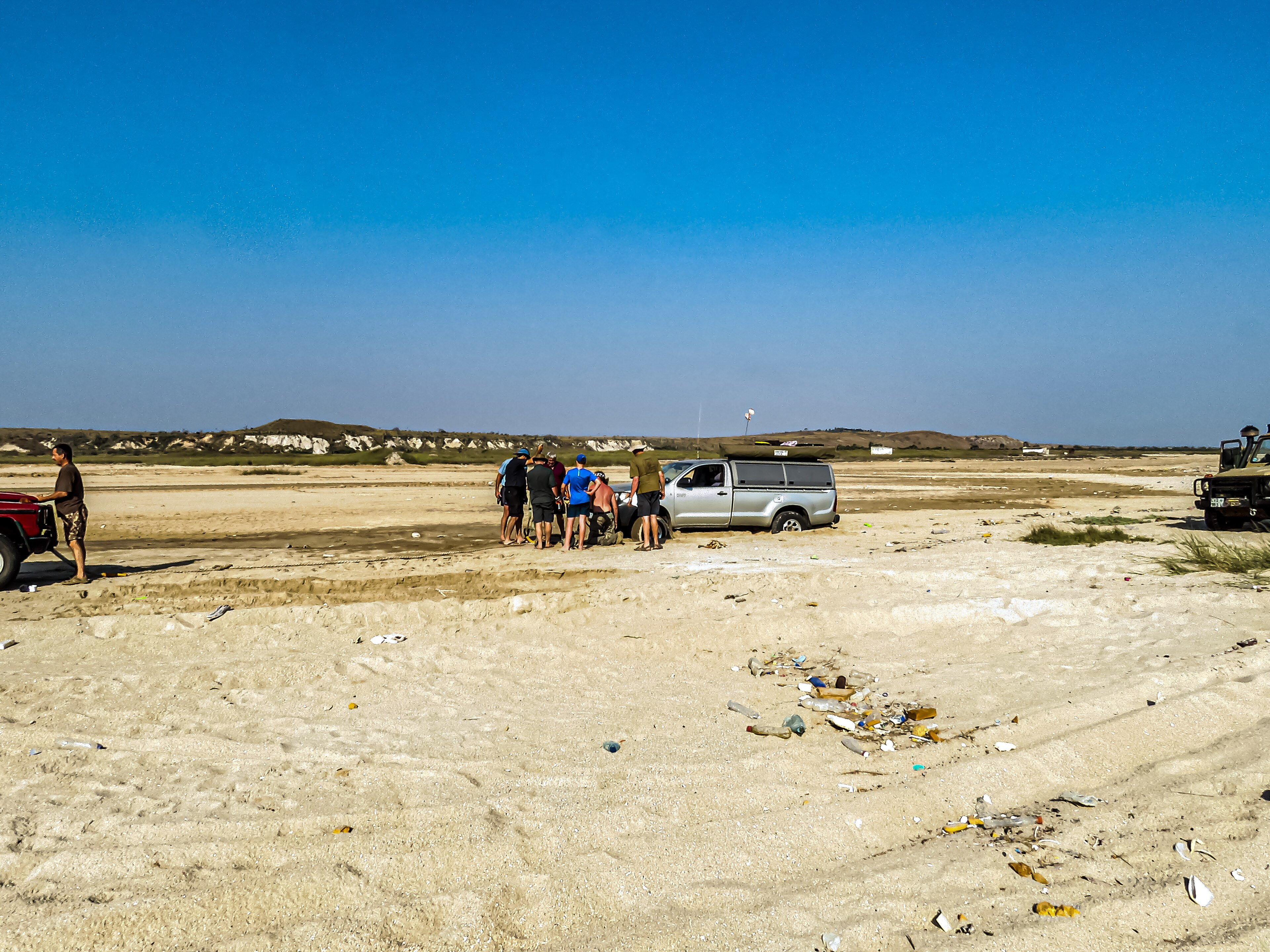 A Toyota bakkie parked on a beach