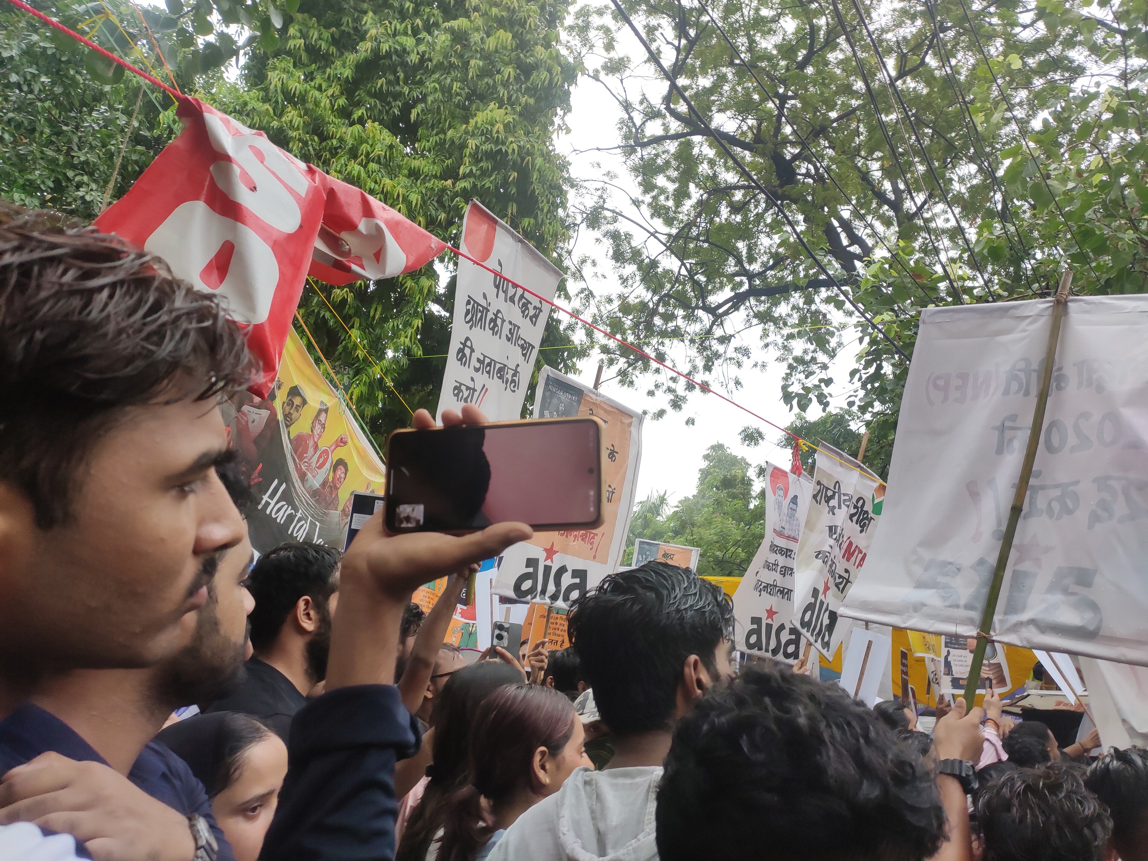 Students hold placards at a protest over the 2026 NEET exam paper leak at Jantar Mantar in New Delhi