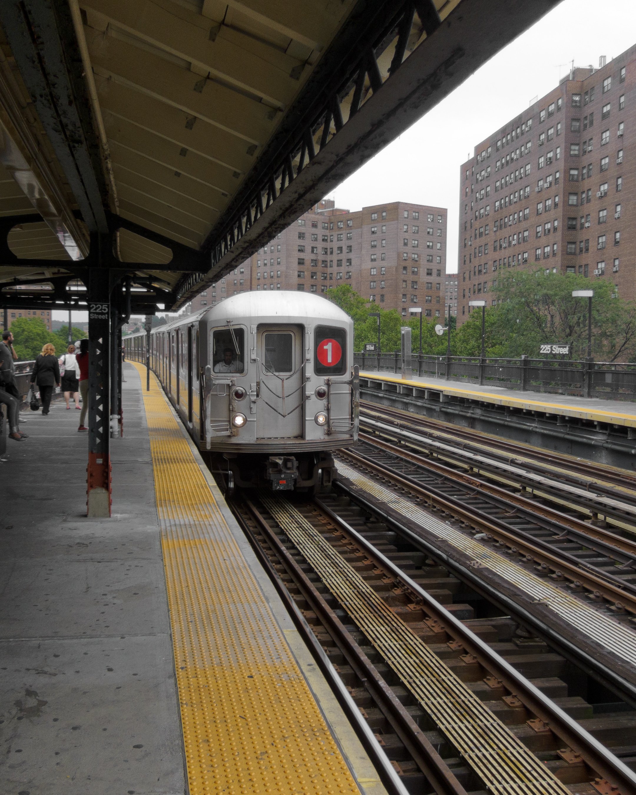 A 1 train pulling into the elevated Marble Hill 225th Street subway station