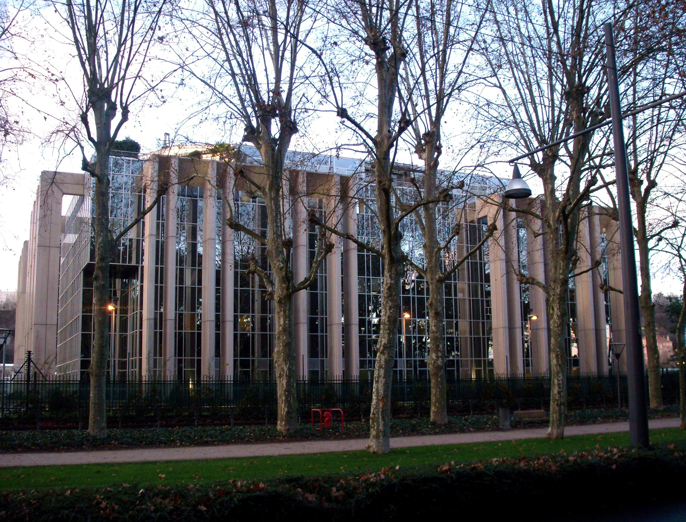 Interpol's world headquarters building in Lyon, France, beside the Rhone river