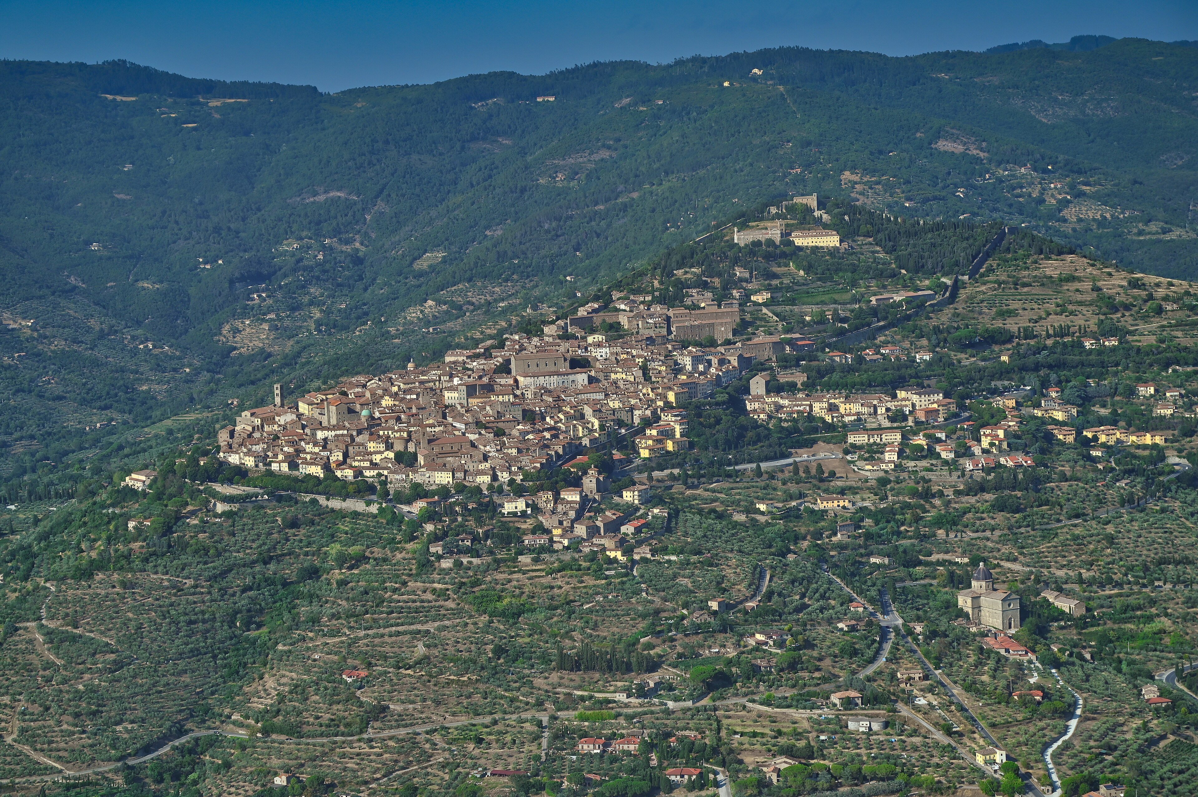 Aerial view of Cortona, a hill town in Tuscany, surrounded by farmland