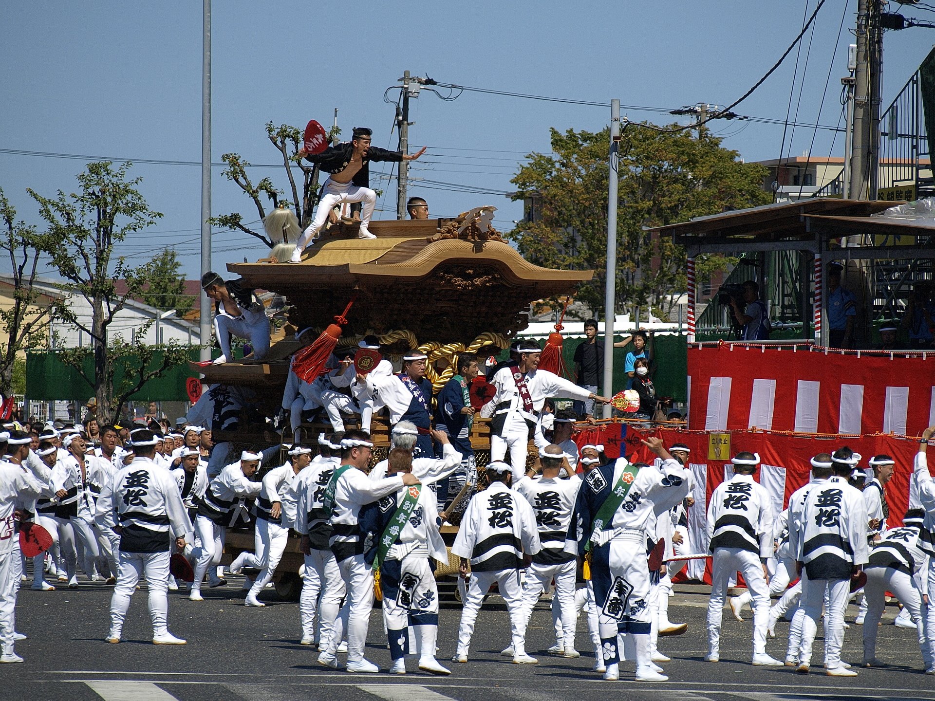 A danjiri float pulled through a street at the Kishiwada festival in Osaka