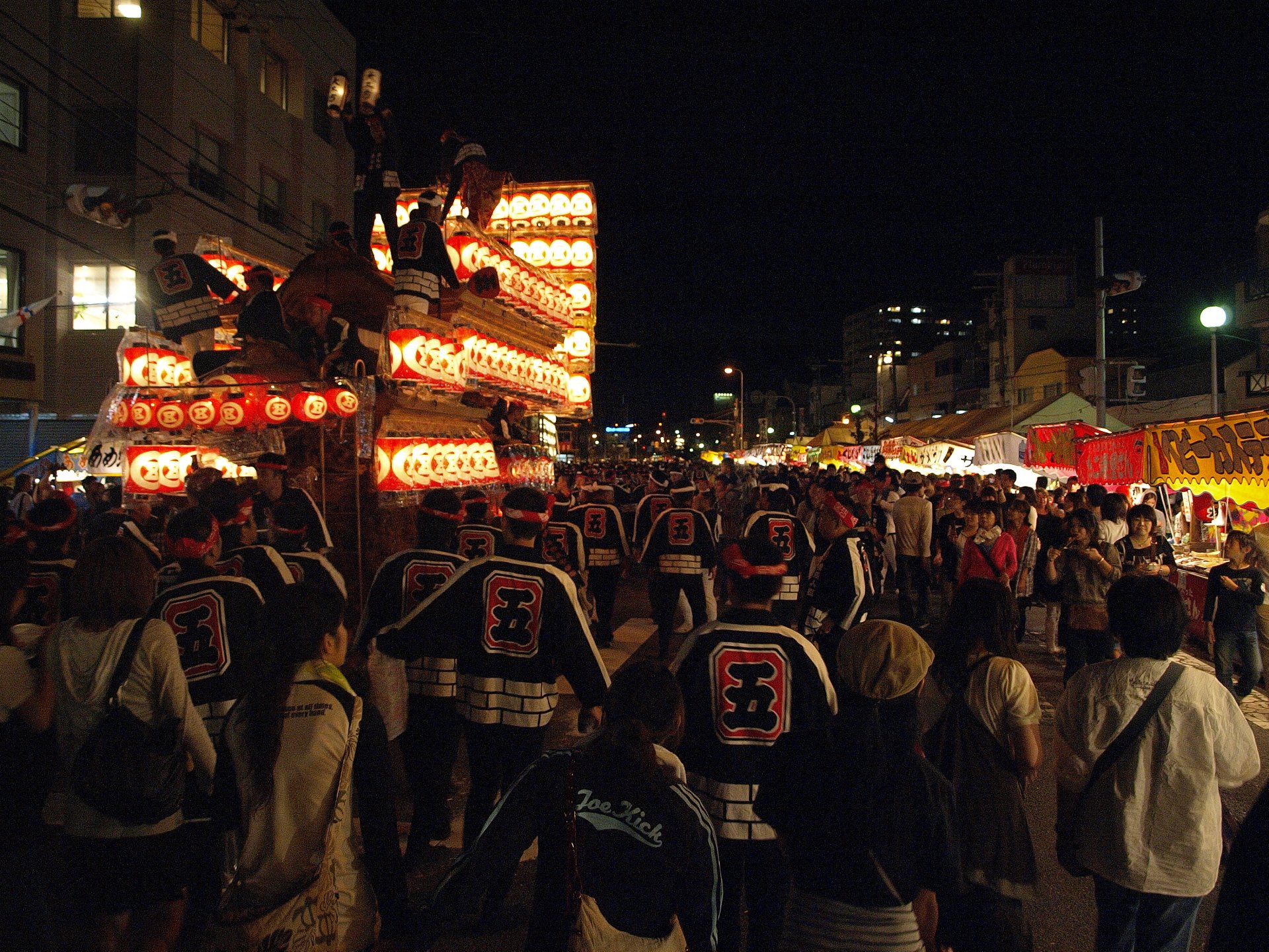 Danjiri floats lit by lanterns at night in Kishiwada