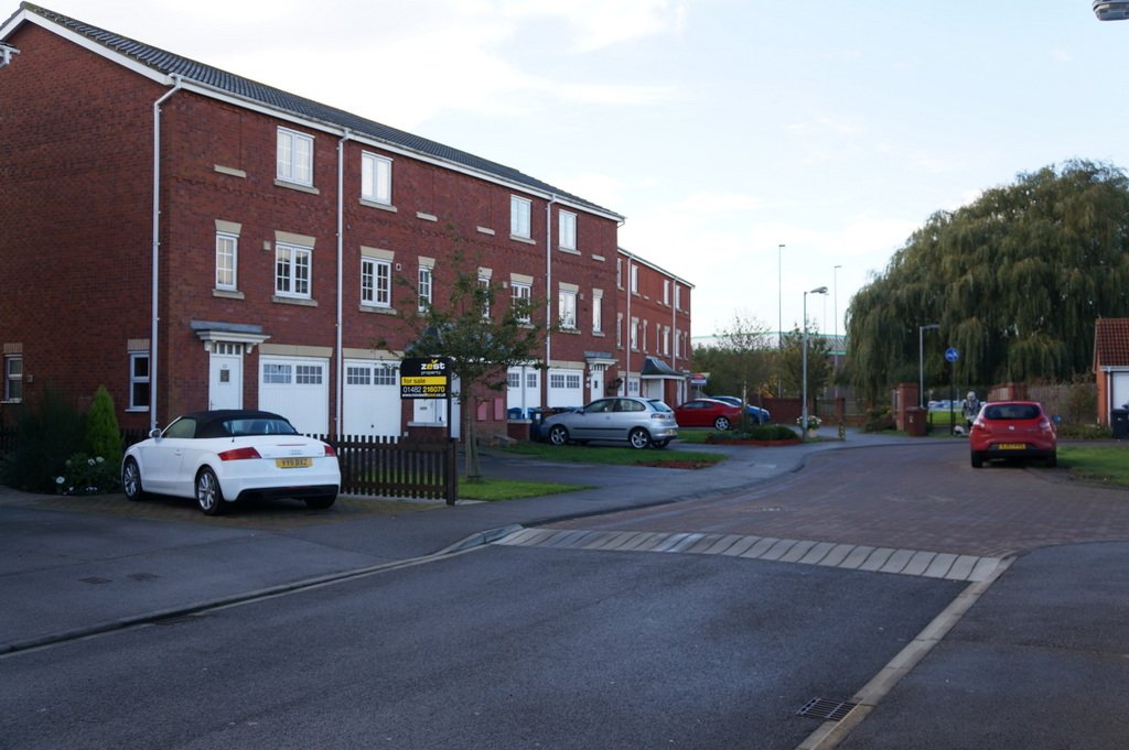 Brick houses on a quiet street called The Willows in Sutton Park, Hull