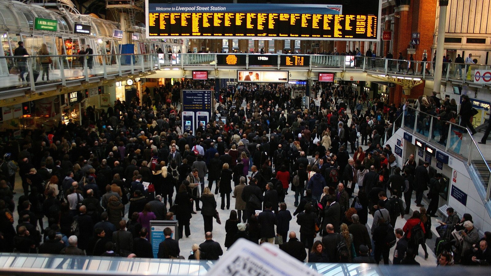 A packed crowd of commuters at Liverpool Street station in London during rush hour