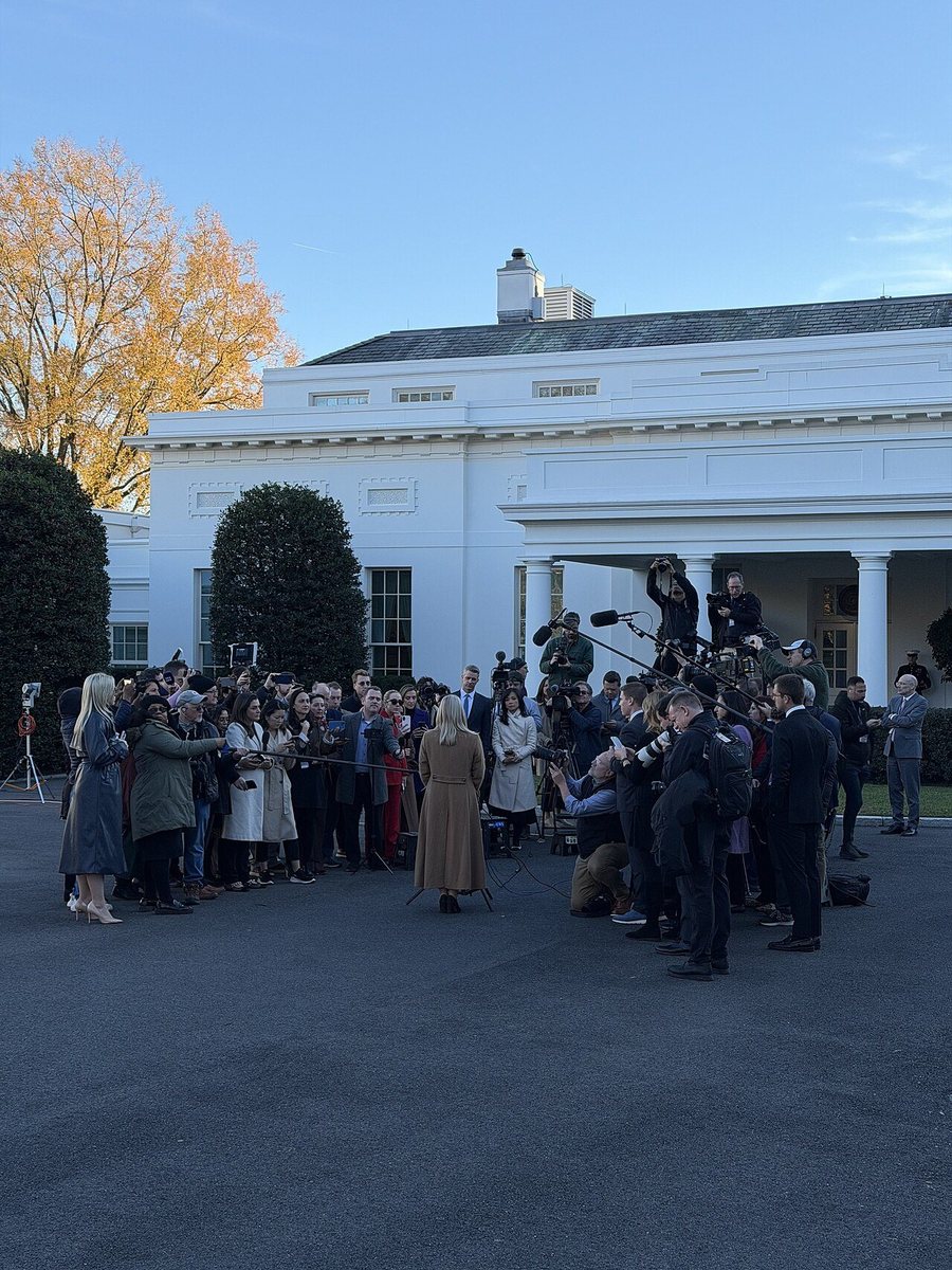 Karoline Leavitt standing outside the West Wing of the White House