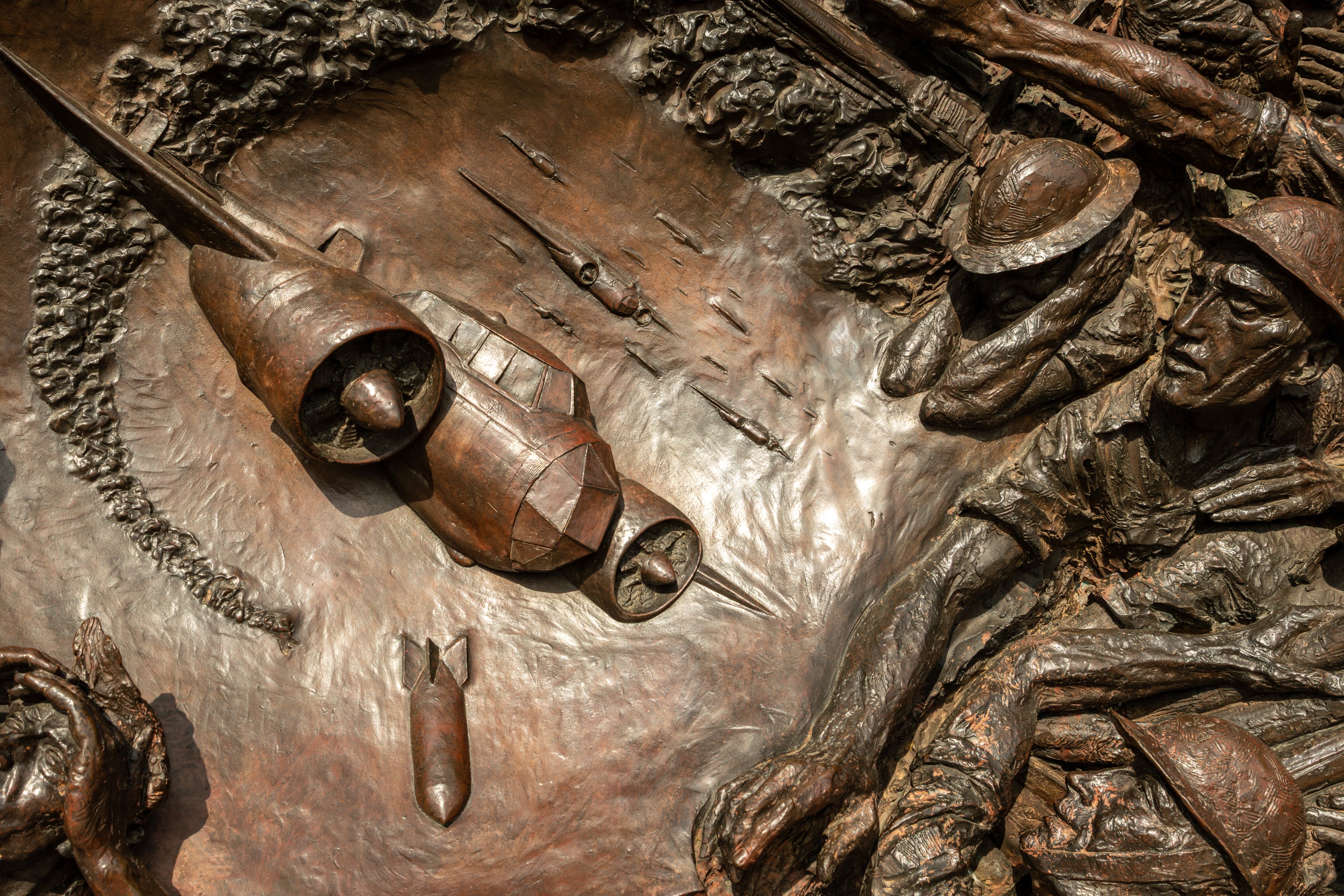 The Battle of Britain Monument on Victoria Embankment in London, a long granite wall with bronze figures of pilots