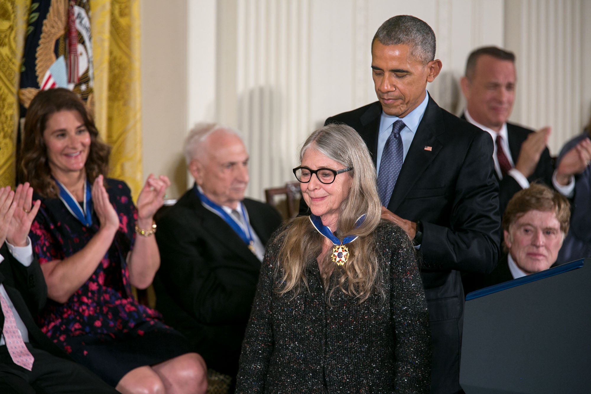 President Barack Obama placing the Presidential Medal of Freedom around Margaret Hamilton's neck in the East Room of the White House