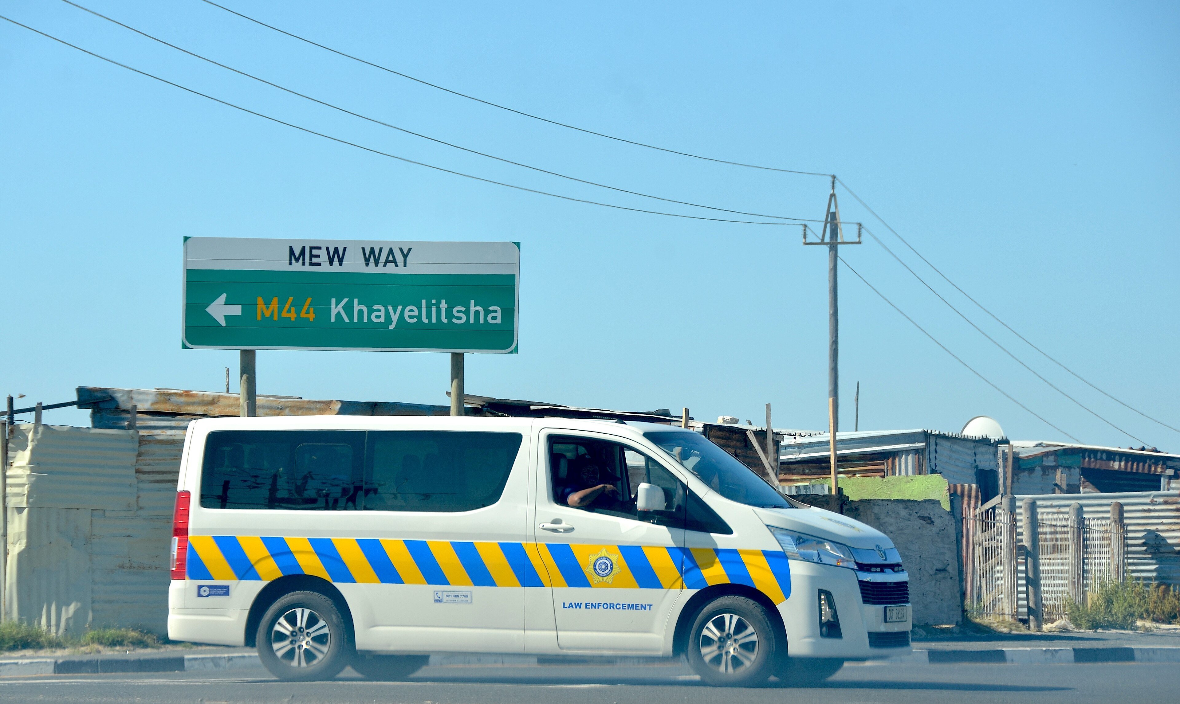 Law enforcement vehicle on Mew Way beside Khayelitsha