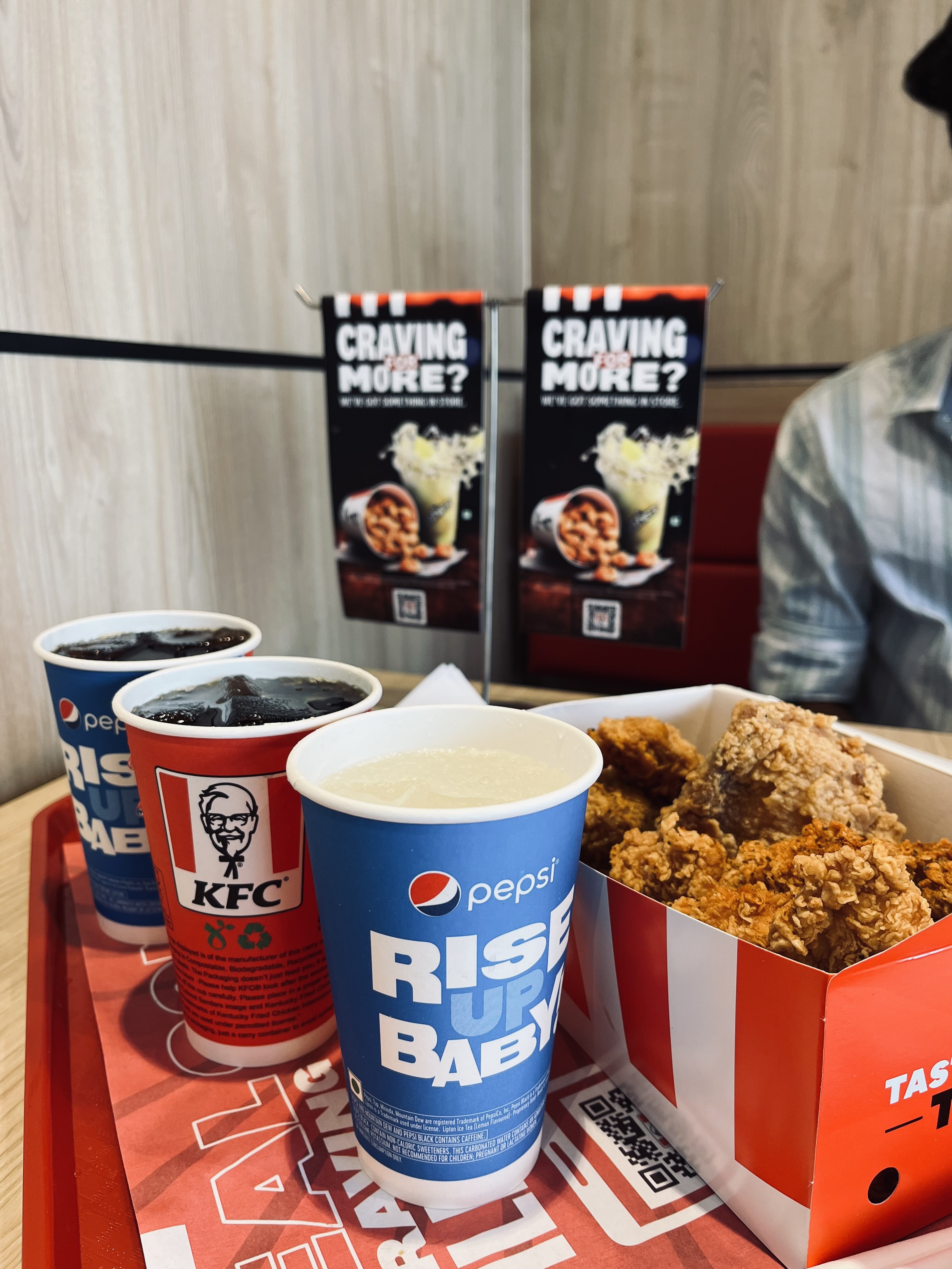 KFC fried chicken served with a fountain drink