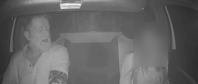 Night dashcam still from inside a bakkie, showing a man driving and a passenger beside him