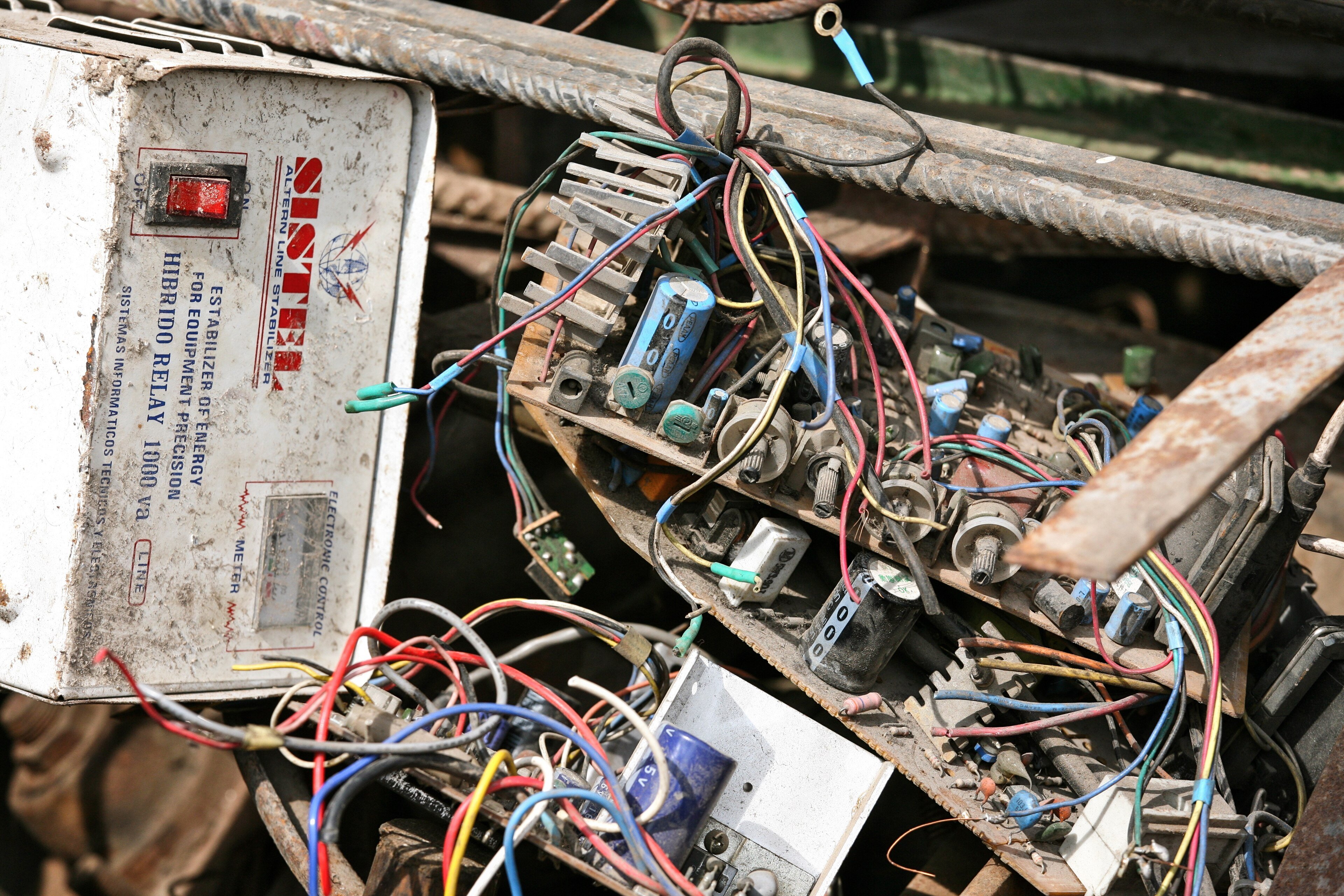 Boxes of collected electronic waste including computers and cables ready for recycling
