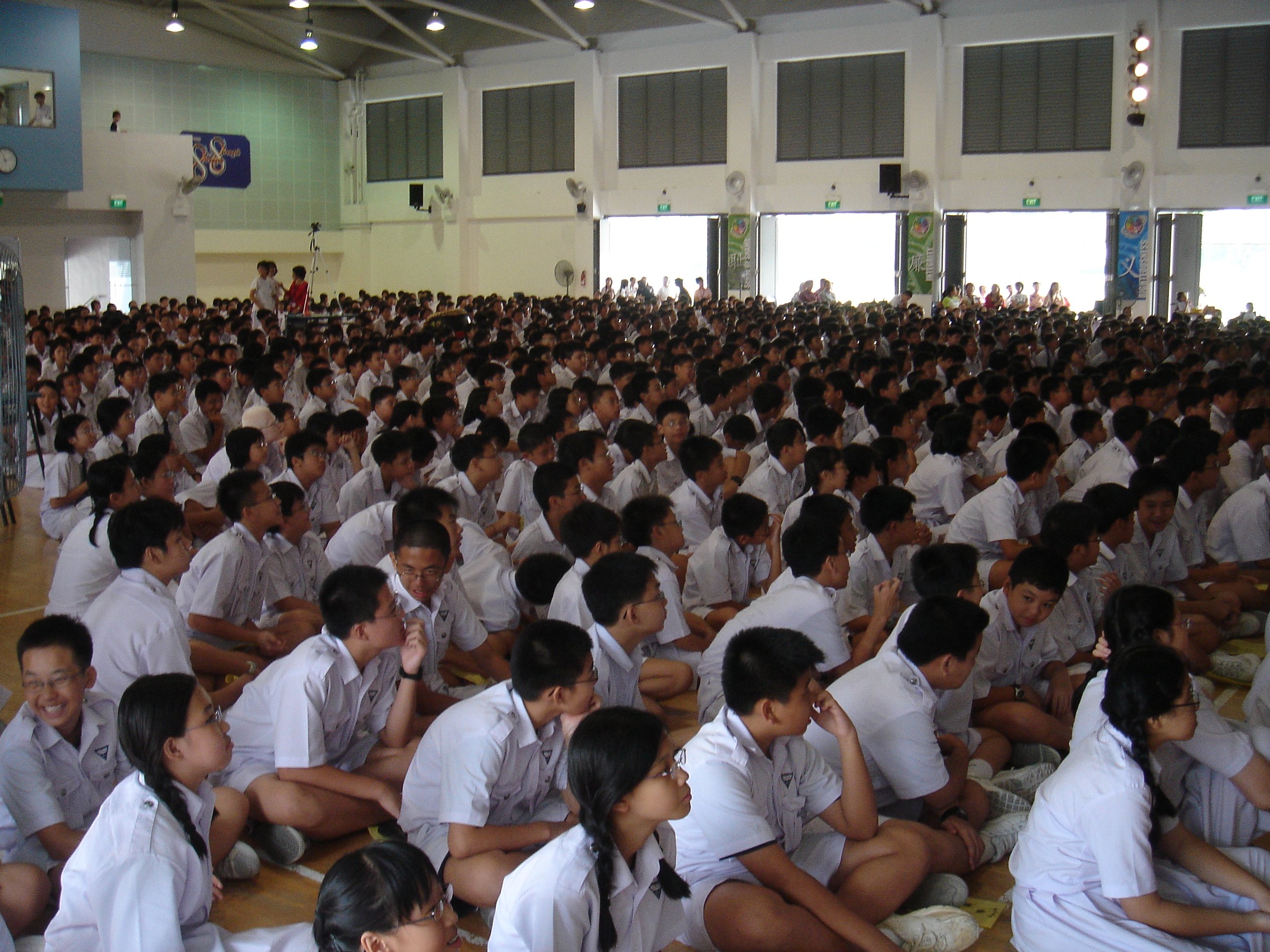 Students gathering in a school hall at Nan Hua High School in Singapore