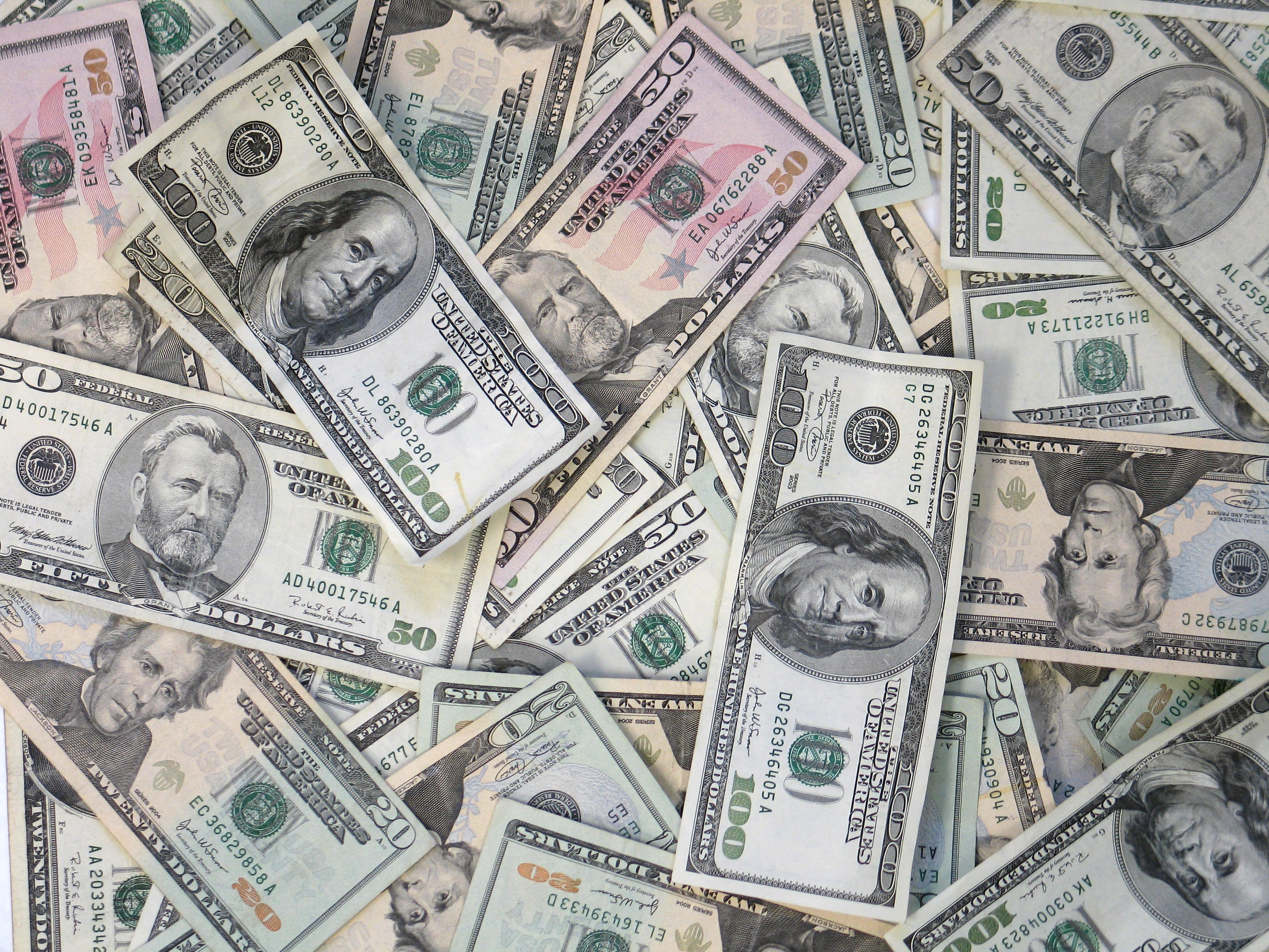 A pile of US dollar bills