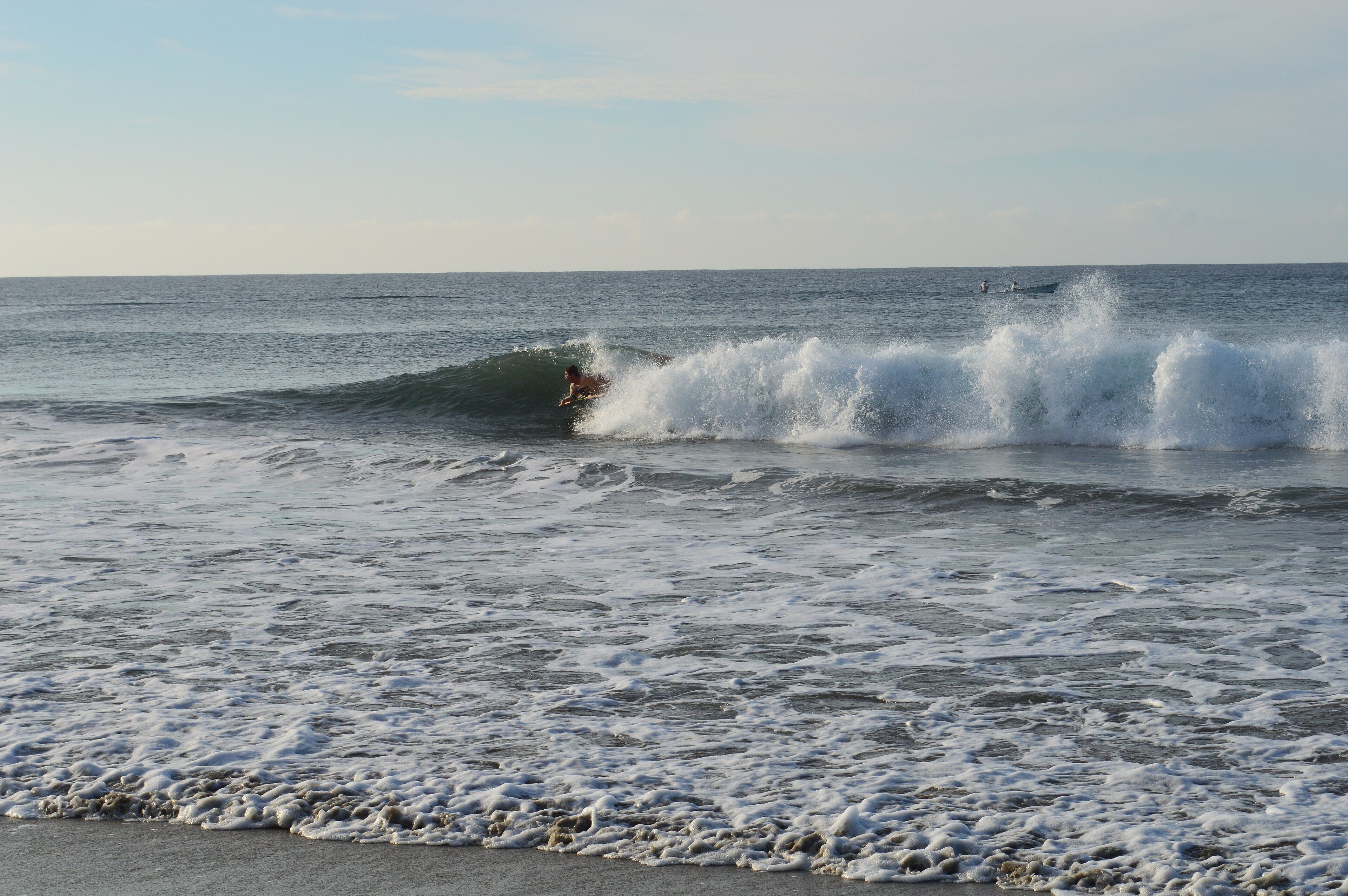 A surfer on a wave off the coast of the Baja California peninsula
