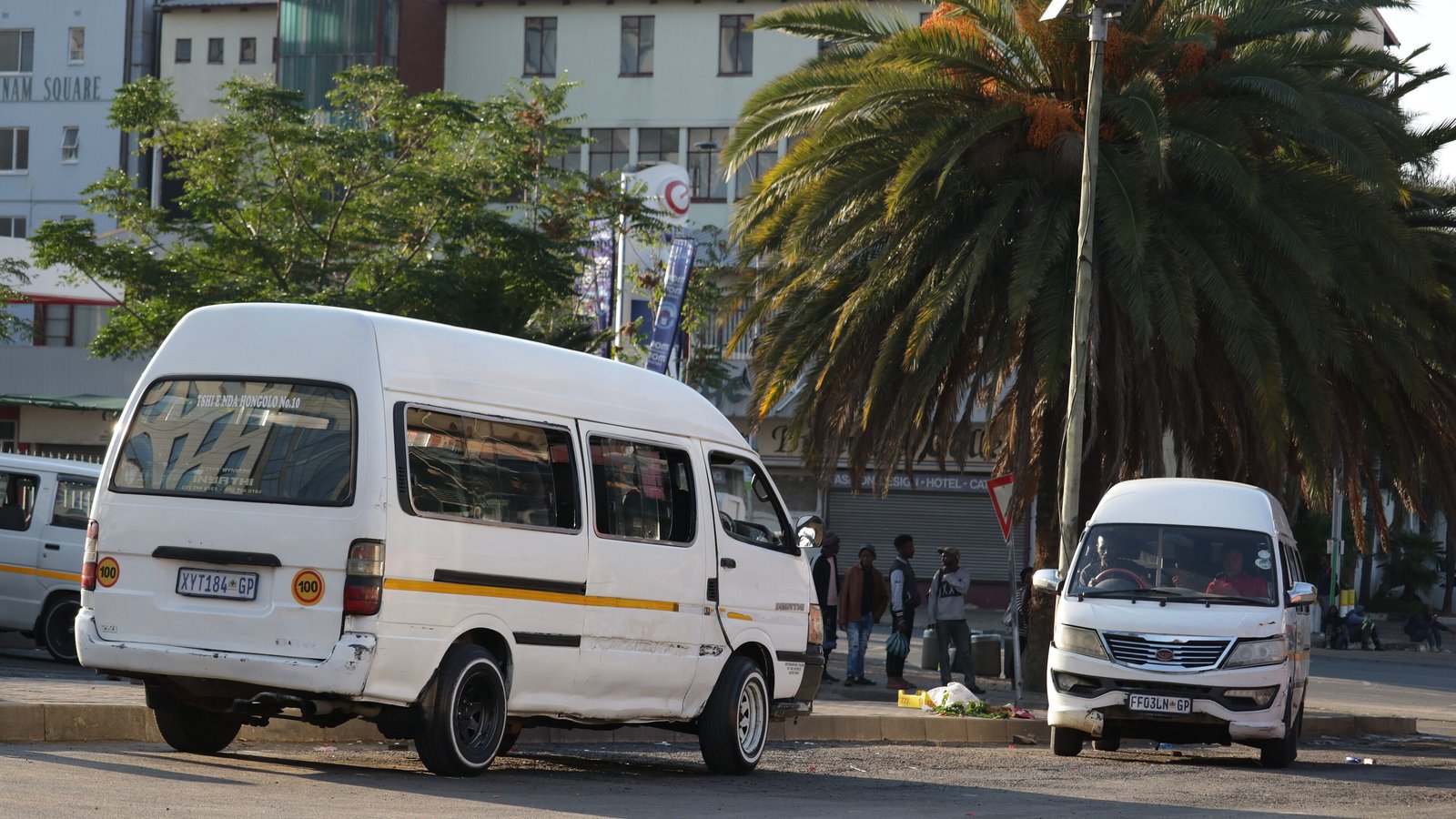 White minibus taxis parked at a taxi rank in Johannesburg