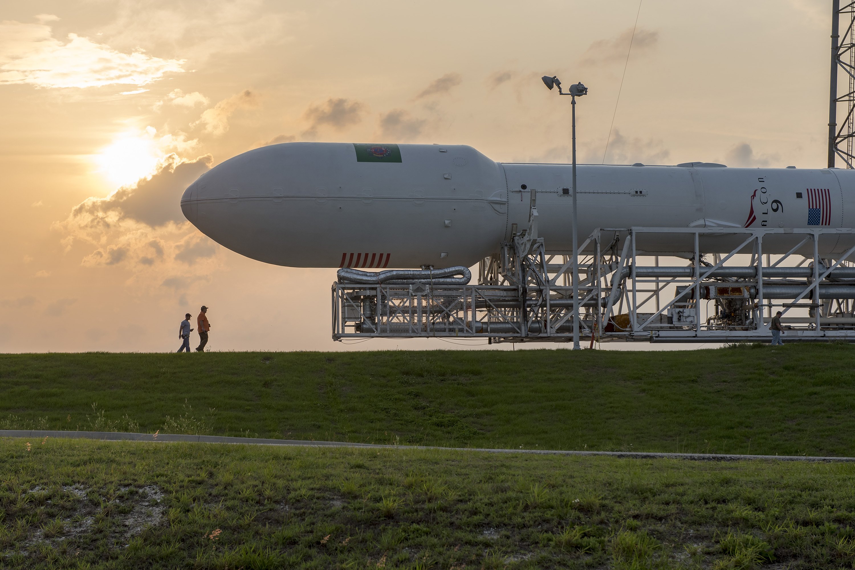 A SpaceX Falcon 9 rocket rolled out to the launch pad