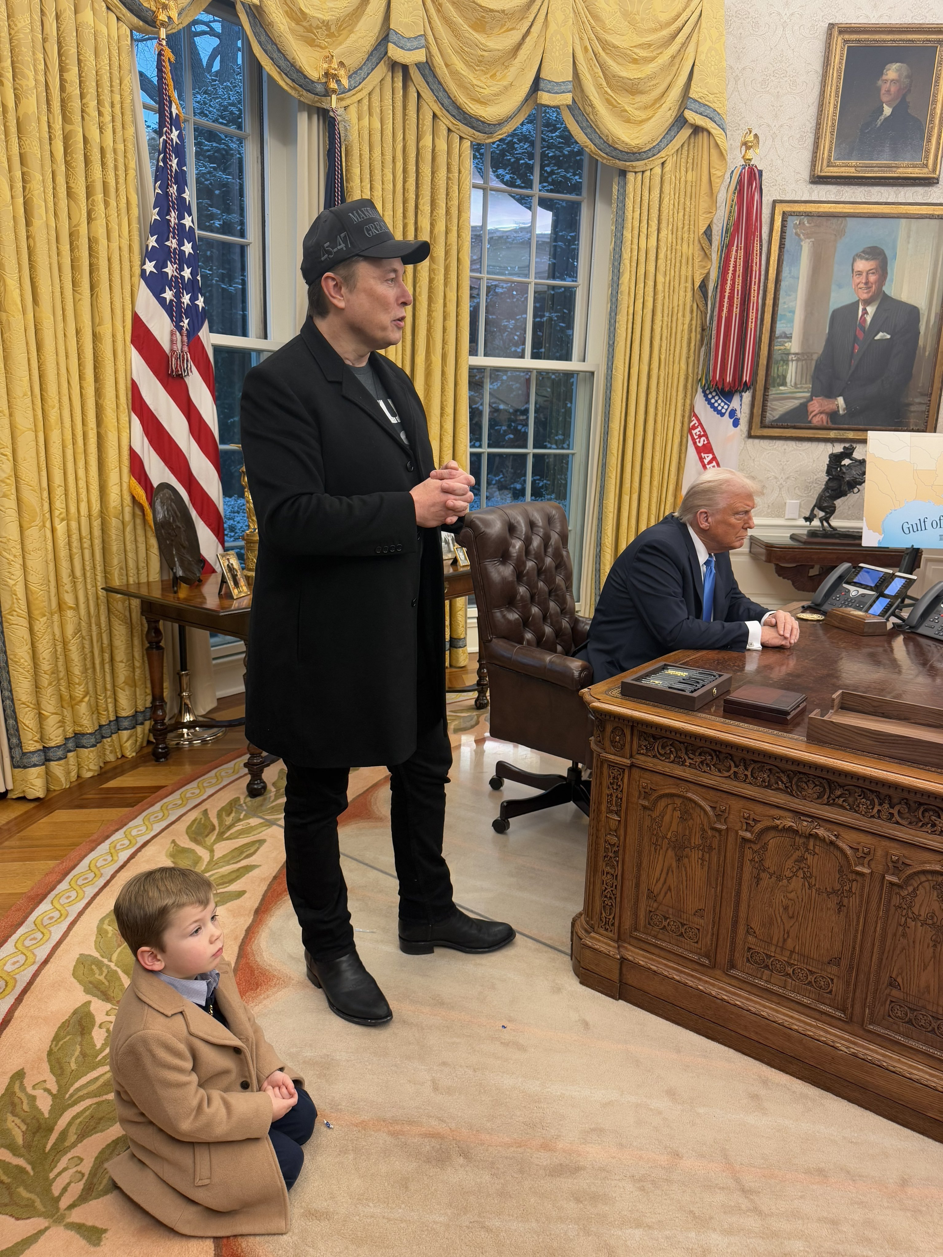 Donald Trump and Elon Musk answer questions from reporters in the Oval Office