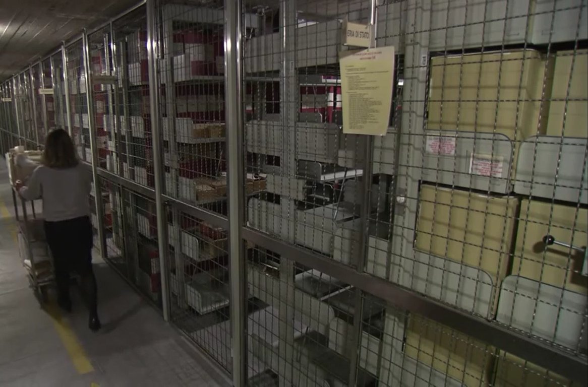 A corridor lined with shelves inside the Vatican Secret Archive