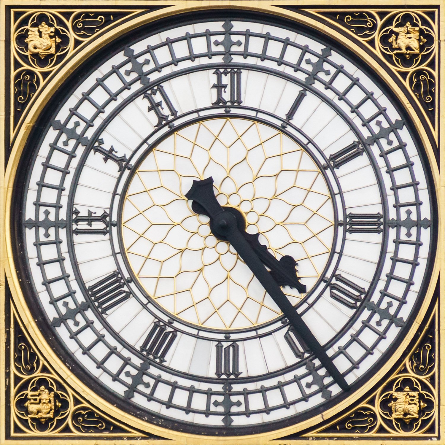 The large clock face of Big Ben on Elizabeth Tower in London, with its black hands and gold numbers